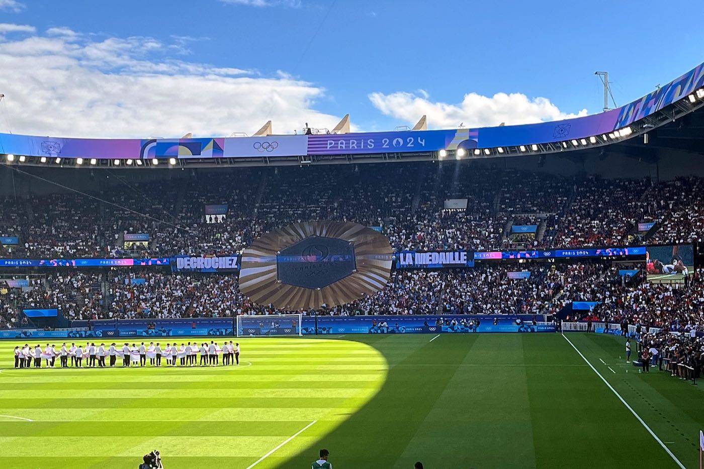 Teams lined up on the pitch at the Parc des Princes before an Olympic football final
