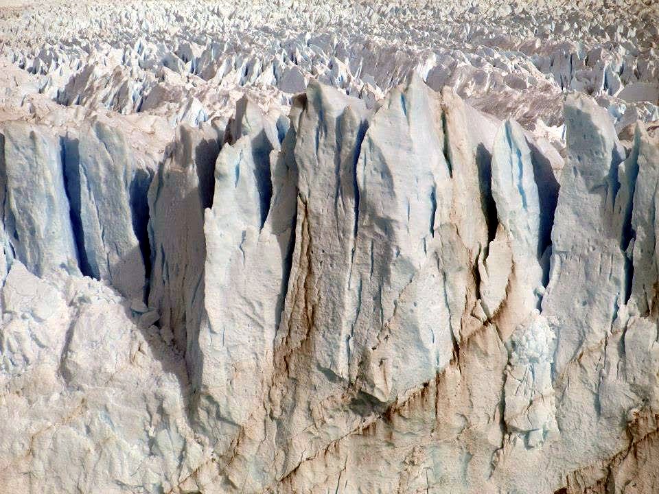 The jagged blue and white ice face of the Perito Moreno glacier up close